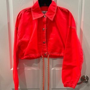 Bright orange cropped nylon jacket from urban outfitters
